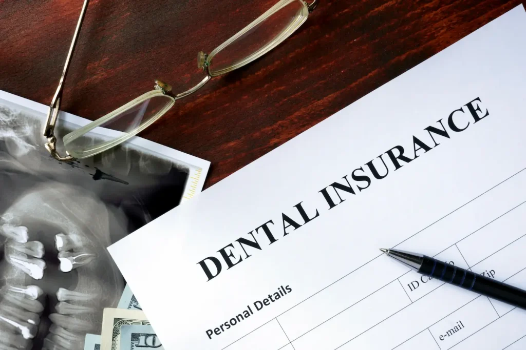 dental insurance form on a table along with an orthopedic x-ray