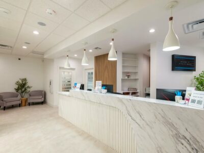 Front desk and waiting chairs inside the Vitality Dental office in Plano